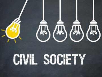 Multiple lightbulbs with text underneath saying civil society.