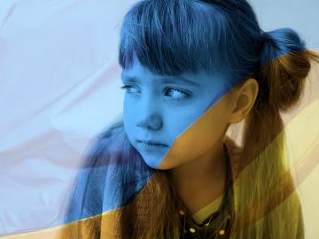 Sad young girl in Ukrainian colours